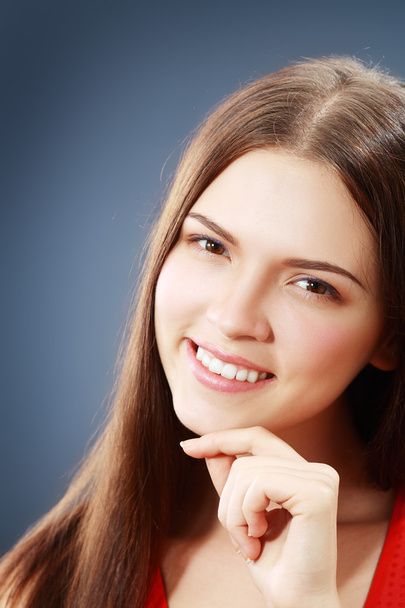Young woman with beautiful smile - Фото, изображение