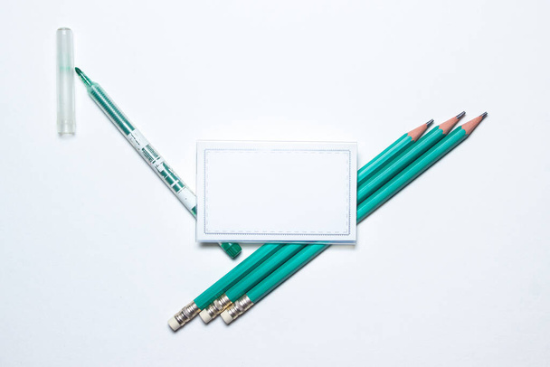 School supplies. Education concept. Stationery. Empty the badge, there is a place for an inscription or a logo. Photo on white background - Photo, Image