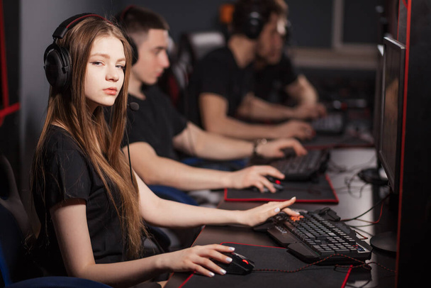 Team of eSport Gamers Playing Video Games on a cyber games contest. - Fotoğraf, Görsel