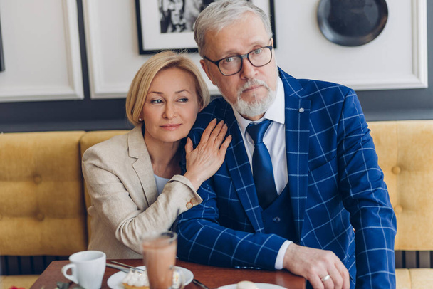 mature gorgeous couple spending weekend in the coffee shop - Фото, изображение