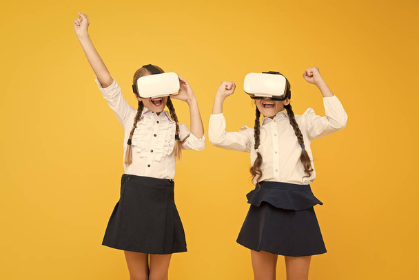 So real. Happy kids use modern technology. virtual reality. small girls in VR headset. future education. back to school. Digital future and innovation. children wear wireless VR glasses - Φωτογραφία, εικόνα