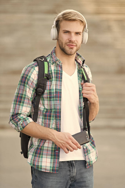 appealing look. school life. Listen music. Modern and digital youth. trendy man. College student earphones smartphone. Online education. Audio book concept. Educational technology. student e learning - Photo, Image