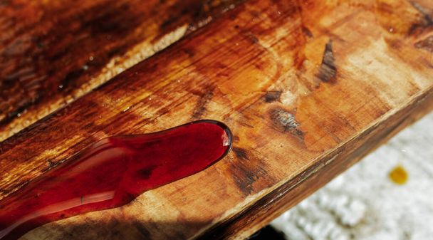 varnish on a wooden product, industrial treatment of furniture with epoxy resin. - Φωτογραφία, εικόνα