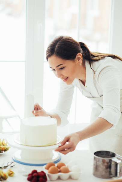 lovely girl making cake beautiful - Foto, imagen
