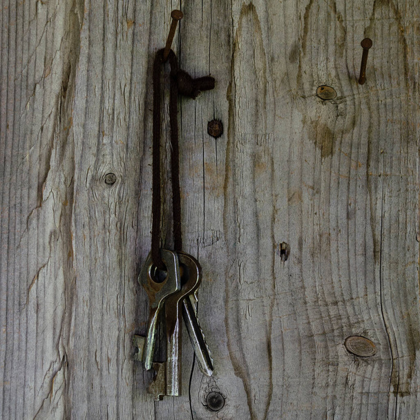 The old keys to the castle hang on the rope. - Photo, image