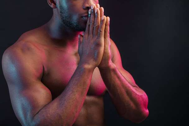 Naked torso of African man posing at studio on dark background, close up. - Fotografie, Obrázek