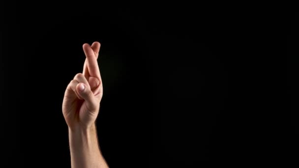Hand showing letter R on dark background. Sign language alphabet - Footage, Video