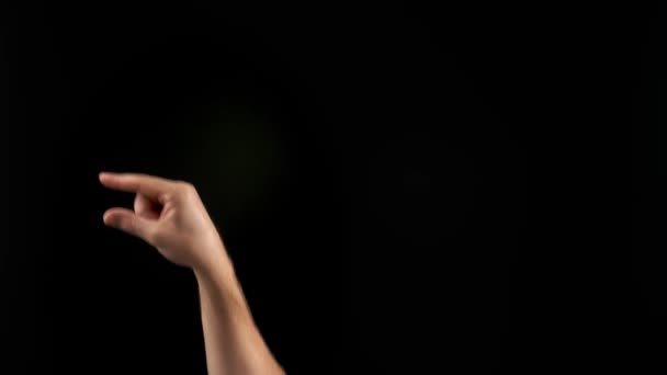 Hand showing letter G on dark background. Sign language alphabet - Footage, Video