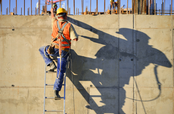 Trabajadores de la construcción en el trabajo - Foto, Imagen