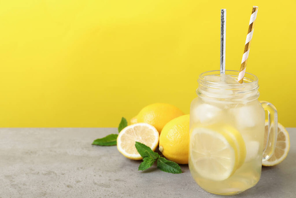 Natural freshly made lemonade with mint on light grey table. Summer refreshing drink - Fotografie, Obrázek