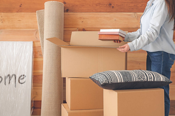 Woman packing moving box at home - Photo, Image