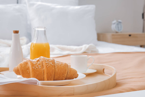 Tasty breakfast on bed in hotel room - Photo, Image