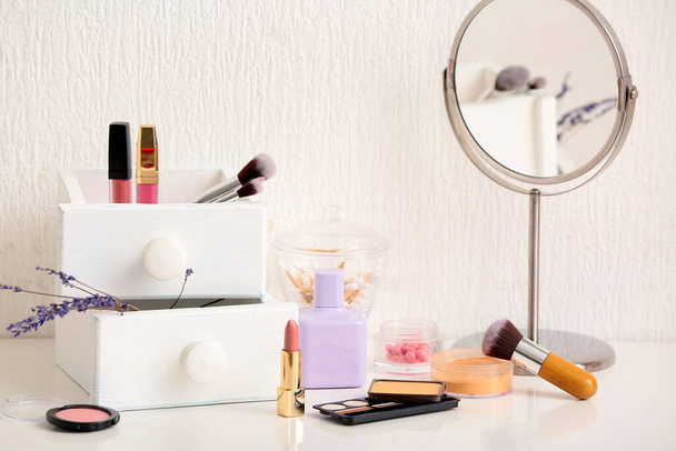 Set of makeup cosmetics with mirror on table - Photo, Image