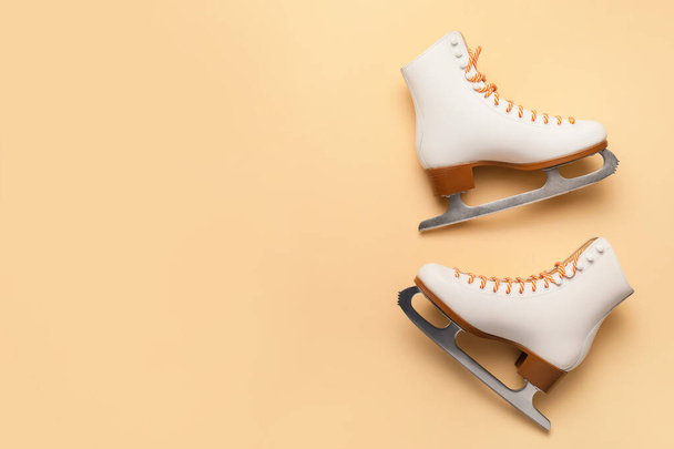 Ice skates on color background - Foto, imagen