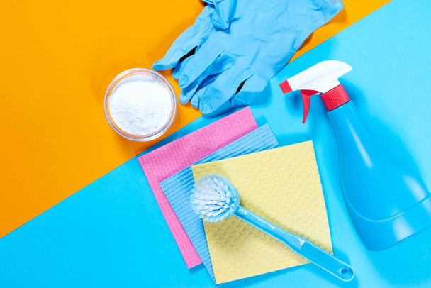 Eco-friendly natural cleaners. Composition with backing soda, vinegar and brushes on color background. - Photo, Image