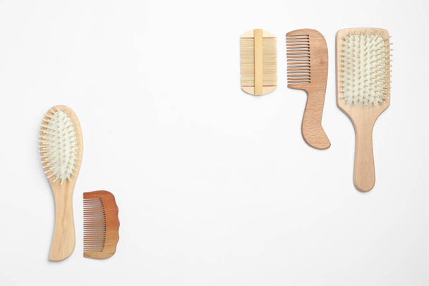 Composition with hair combs and brushes on white background, top view - Фото, изображение