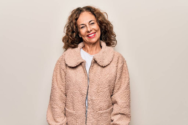Middle age beautiful woman wearing casual jacket standing over isolated white background with a happy and cool smile on face. Lucky person. - Photo, Image