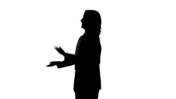 Tir de silhouette de femmes en costume veste avec des applaudissements - Séquence, vidéo