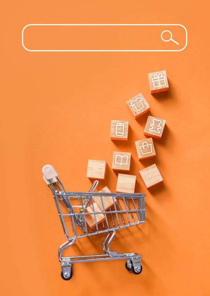 Online Shopping. Trolley basket from the supermarket on an orange background. home delivery - Fotoğraf, Görsel