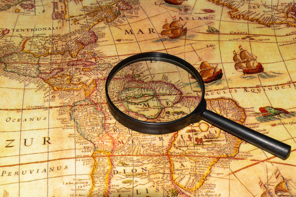 View of a magnifying glass on a map of the Old World, America - Photo, Image