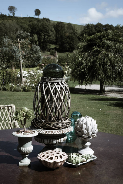Ancient decorative objects in the garden insummer - Photo, Image