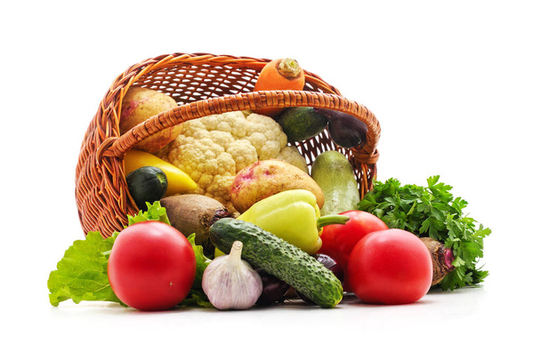 Vegetables spilled from the basket isolated on white background. - Fotografie, Obrázek