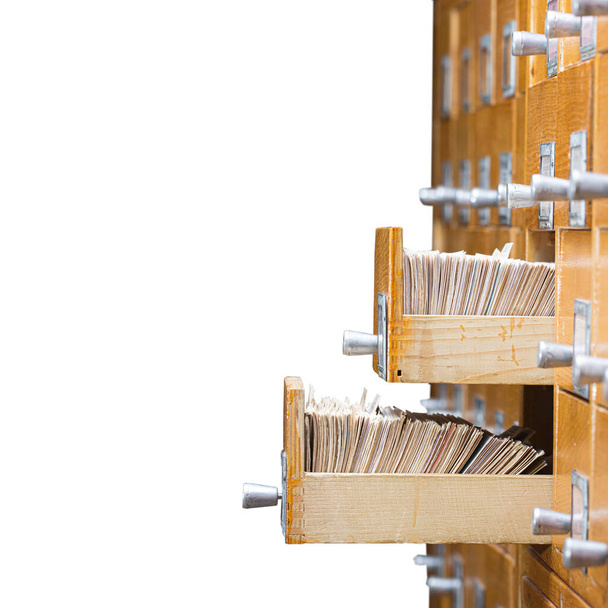 Library or archive reference card catalog. Database, knowledge base concept. Old library or archive reference catalogue with opened card drawer - Φωτογραφία, εικόνα