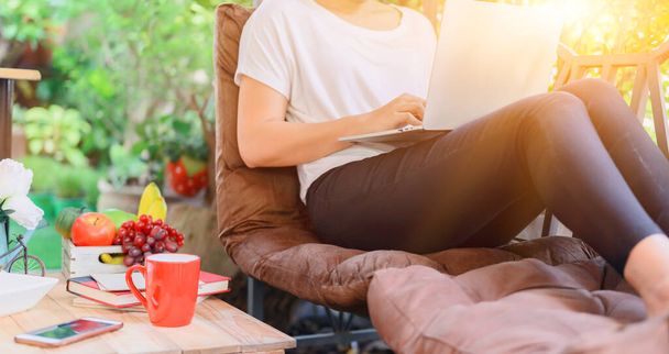 Work from home (WFH) concept, woman working at  home garden - Foto, Bild
