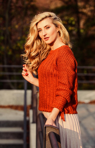 I would stay here forever. girl long blond hair city walk. autumn woman curly hair. female beauty. girl in corrugated skirt and sweater. Pleated trend. haidresser and makeup. fall fashion season - Fotografie, Obrázek