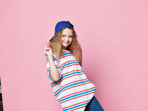 Fashionable little girl to clothes lifestyle blue cap fun  - Foto, afbeelding