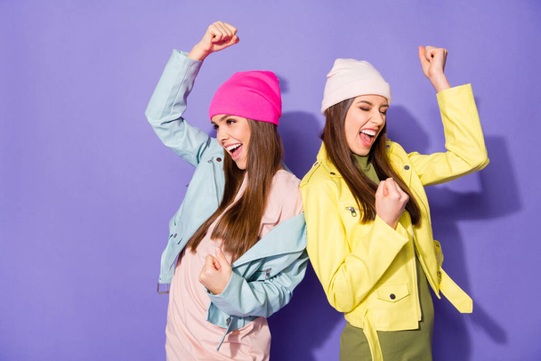 Portrait of nice attractive lovely pretty charming dreamy cheerful cheery girls having fun celebrating good news isolated on bright vivid shine vibrant violet lilac purple color background - Foto, afbeelding