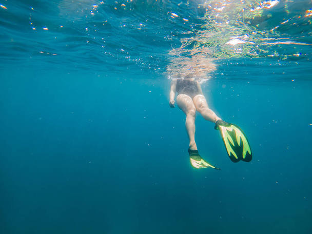 woman in flipper view underwater beach vacation summer season - Photo, image
