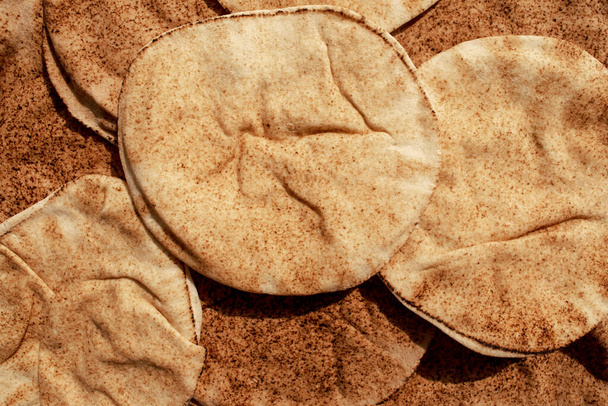 Background made of multigrain pita bread. Famous traditional Arabic flat bread. Egyptian bread. - Photo, Image