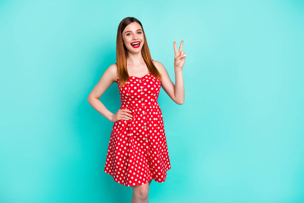 Portrait of nice pretty cute girl enjoy spring weekend holiday show v-sign wear retro style skirt isolated over green color background - Foto, afbeelding
