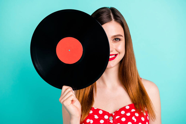 Portrait of positive cheerful girl hide her face turntable music plate wear retro style good look skirt isolated over turquoise color background - Foto, Imagem