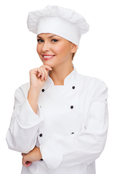 Smiling female chef dreaming - Foto, Imagen