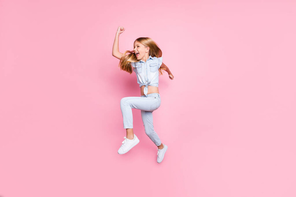 Full length body size view of her she nice attractive lovely small little funny purposeful cheerful cheery preteen girl jumping running fast isolated on pink pastel color background - 写真・画像