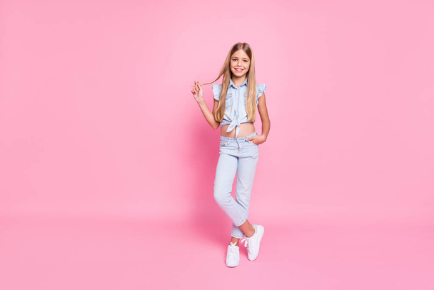 Full length body size view of her she nice fashionable attractive lovely pretty content cheerful cheery preteen girl touching curl posing isolated over pink pastel color background - Фото, изображение