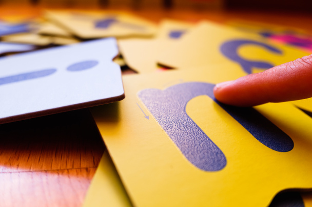 Montessori letter cards, finger swipe texture, enhances dyslexic children's learning. - Photo, Image