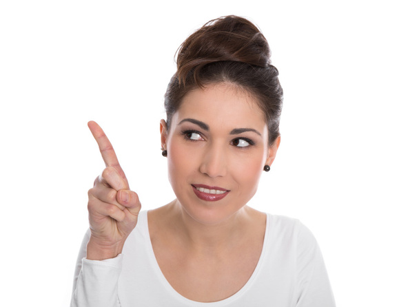 Happy young woman pointing with forefinger isolated on white. - 写真・画像