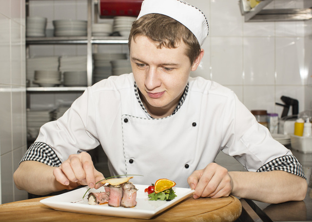 Chef preparing food in the kitchen - Photo, image