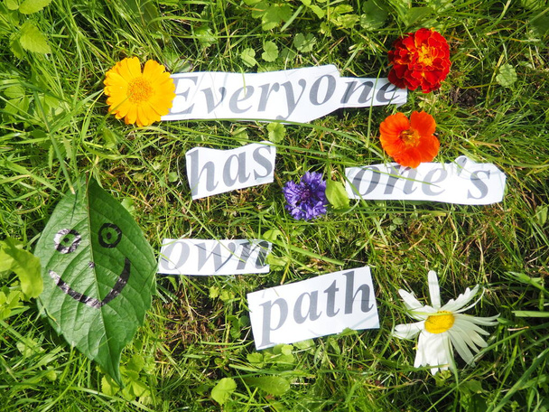 an inscription made of cut words. proverb. everyone has one's own path. - Φωτογραφία, εικόνα