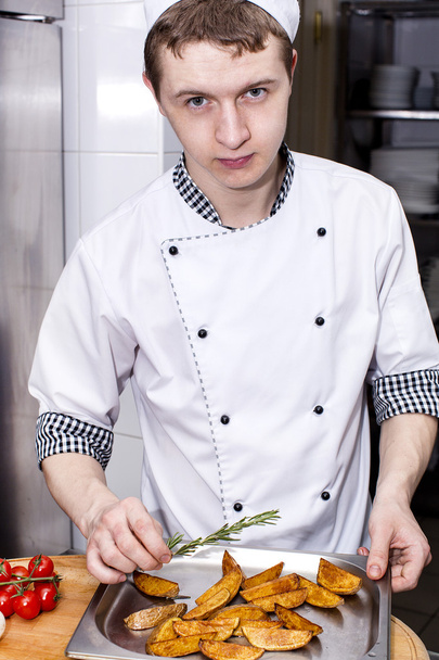 Chef preparing food in the kitchen - Fotó, kép