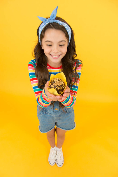 Sweet yummy muffin small girl, chocolate snack concept - Фото, зображення