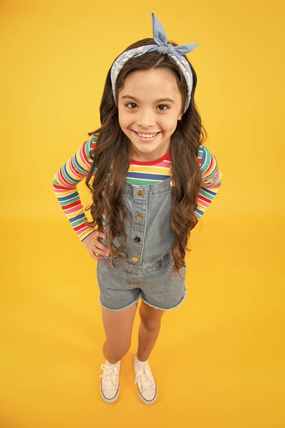 Professional tips hair care. International childrens day. Adorable smile. Cute baby headscarf bow. Adorable little girl with perfect curly long hair. Shampoo hair and conditioner. Hairdresser salon - Fotoğraf, Görsel