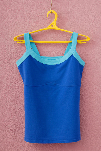 Sports tee shirt is on yellow clothes-hanger - Foto, immagini