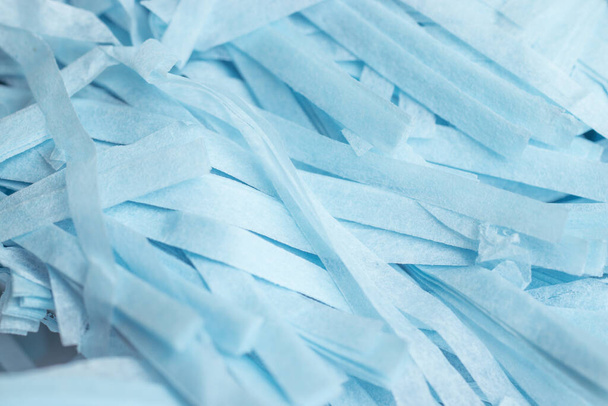 Blue shredded paper pieces texture background. Web design backdrop. - Φωτογραφία, εικόνα