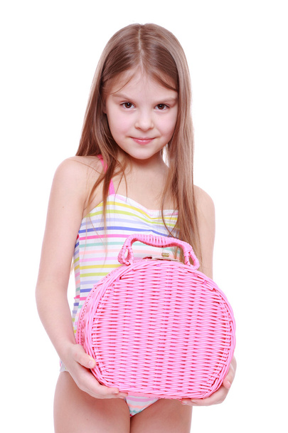 Little girl in swimsuit with basket - Zdjęcie, obraz