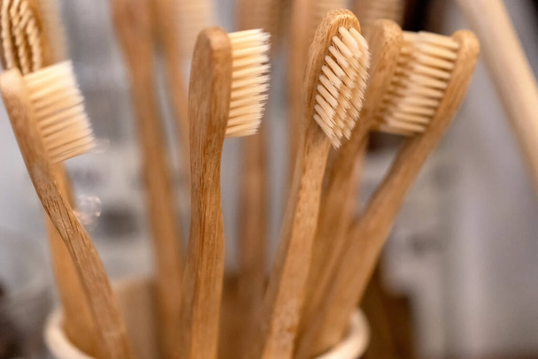 Bamboo toothbrush in zero waste shop. Eco friendly biodegradable toothbrush. - Photo, Image
