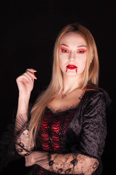 Caucasian girl dressed up like a vampire for halloween - Photo, Image